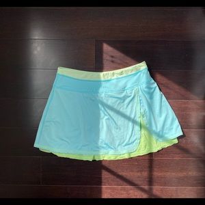 Kyodan athletic skirt in turquoise blue/lime green